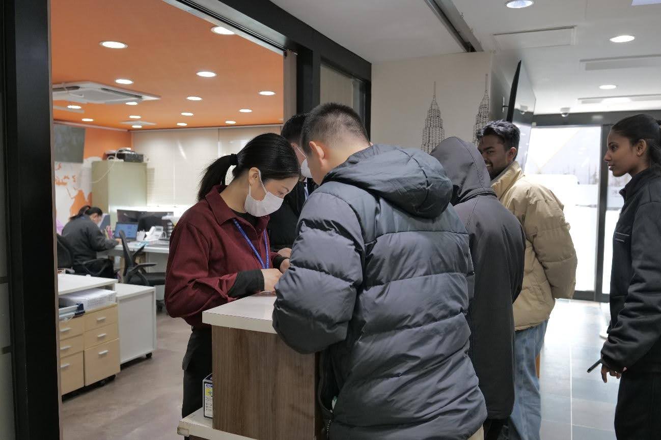 International students receiving help at reception